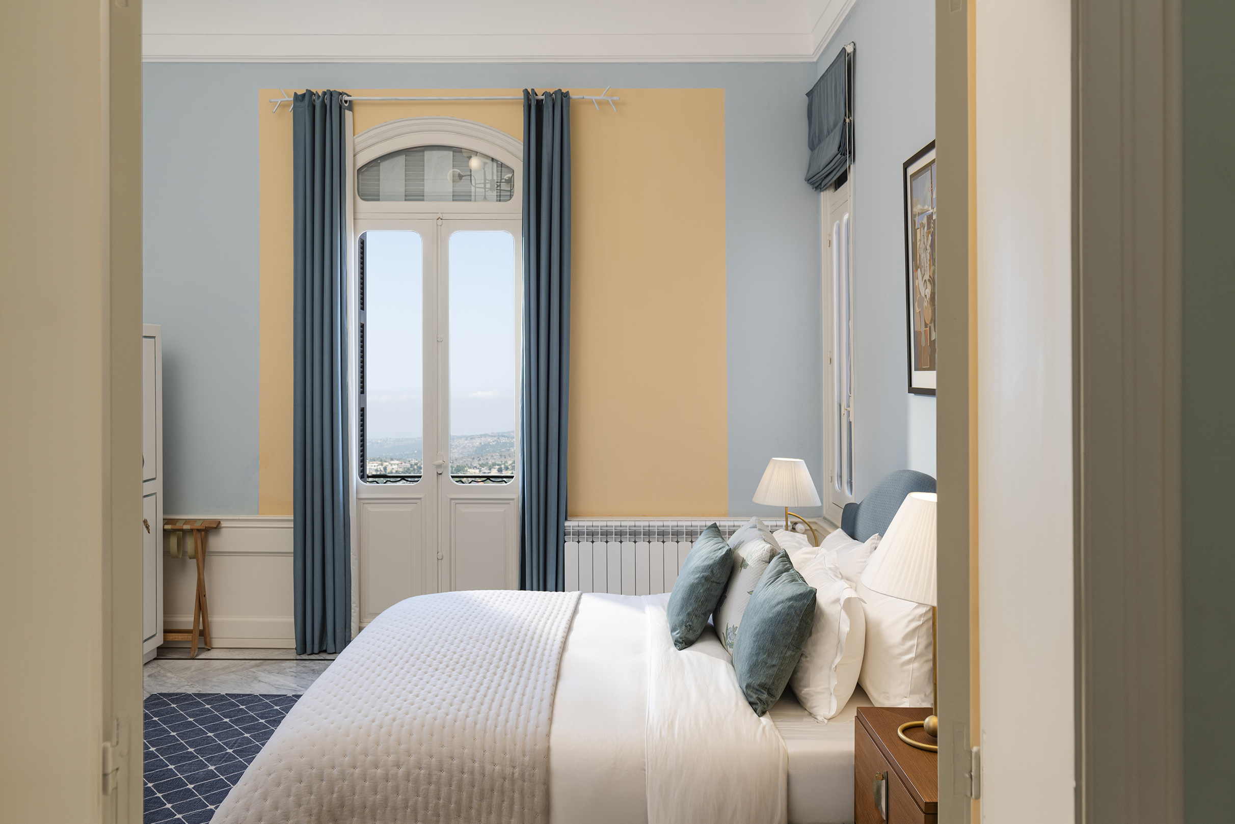 A blue bedroom with a view at Beit Noun Gueshouse in Mechmech